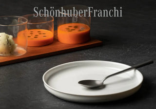 Elevate your dining experience with Schönhuber Franchi's exquisite tableware and glassware, crafted in collaboration with top designers. Buy now on SHOPDECOR®