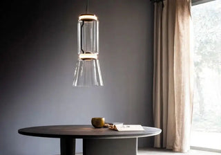 Transparent glass modules awaken after dark, forming luminous columns and suspended compositions with a striking architectural presence. ShopDecor®: available now