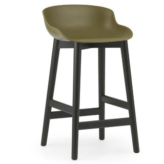 Normann Copenhagen Hyg black oak bar stool with polypropylene seat h. 65 cm. Normann Copenhagen Hyg Olive - Buy now on ShopDecor - Discover the best products by NORMANN COPENHAGEN design
